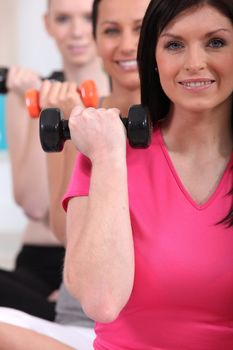 Women working out with dumbbells