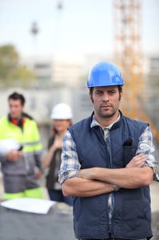 Foreman stood in front of two colleagues