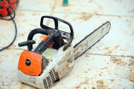 Chain-saw on construction site