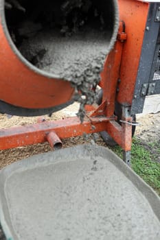 Wheelbarrow full of wet cement