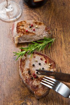 grilled meat fillet on wooden background