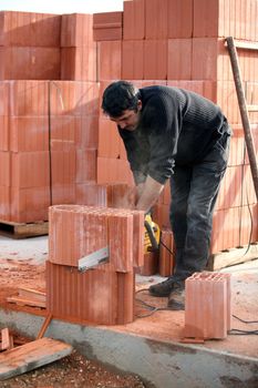 Builder cutting blocks to size