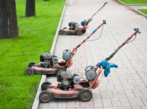 Old lawnmowers on the street in the city