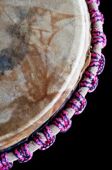 Close up of the djembe isolated on black background