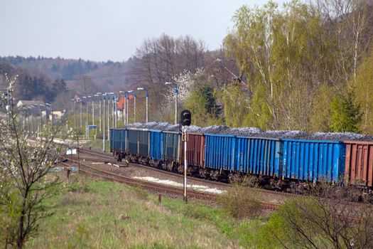 Freight train with coal on the station
