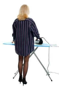 Sexy housewife ironing clothes on a white background