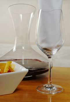 Wineglass with napkin, snack and red wine (Selective Focus)