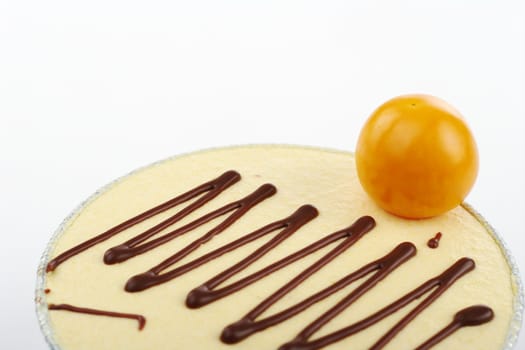 Small cake garnished with physalis berry (Selective Focus)