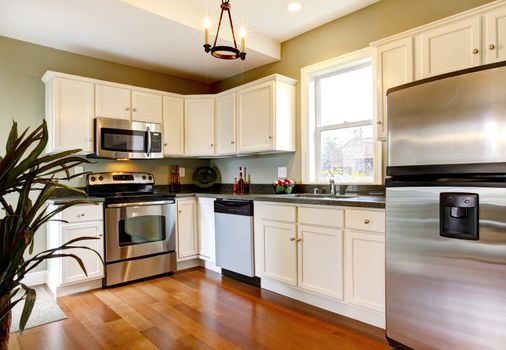 Simple and small new green kitchen.