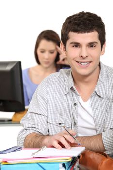 young people studying in a classroom