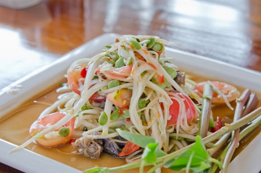favorite food of thailand,  spicy papaya salad  with mixed vegetable on  dish