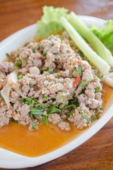 Thai dish of spicy minced pork eaten with vegetable