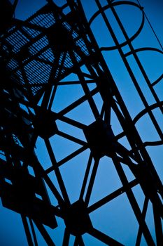 Abstract metal structure silhouette and blue sky