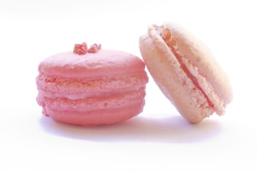 two macaroons on white background
