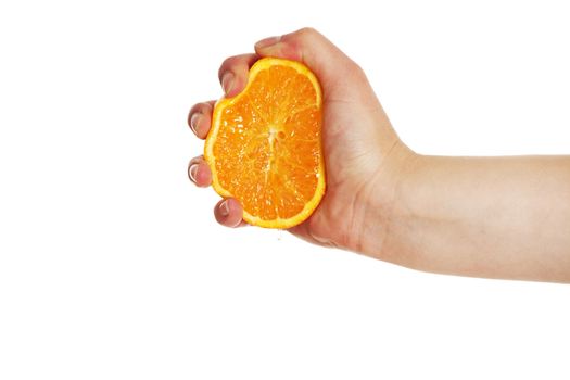 Hand squeezing fresh orange isolated on white background