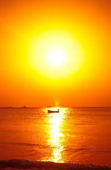 a boat on the sea at sunset in thailand