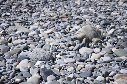 Marine rocks on the beach in sunny day