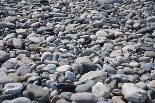 Marine rocks on the beach in sunny day