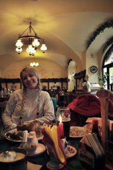 Beautiful young woman in National Czech restaurant