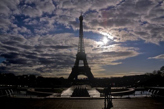 Backlit silhouette of Eiffel Tower in Paris