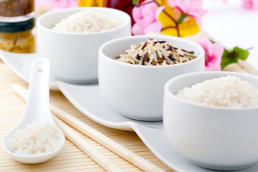 porcelain bowls of uncooked rice