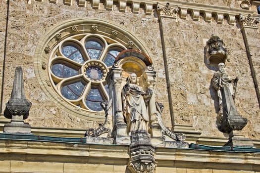 Church architectural detail - window and saint statue, Marija Bistrica, Croatia