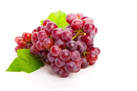 Red grape with leaf isolated on white background