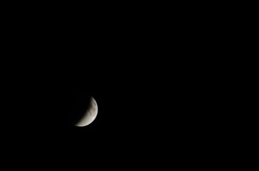 Half moon at night with black sky