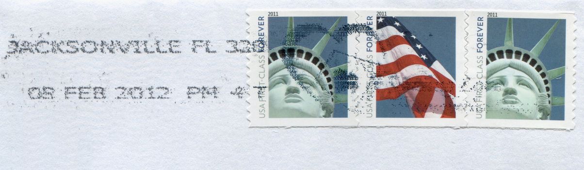 USA - CIRCA 2011: Stamps printed by USA post showing American patriotic symbols Statue of Liberty and Flag circa 2011 in USA