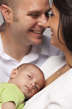 Happy Young Attractive Mixed Race Family with Newborn Baby.