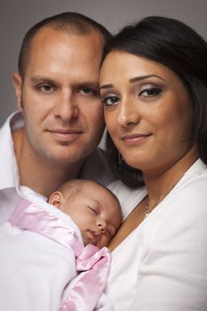 Happy Young Attractive Mixed Race Family with Newborn Baby.