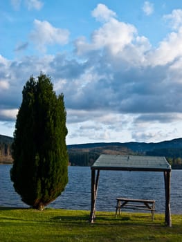 picnic table with a beautiful view over a lake