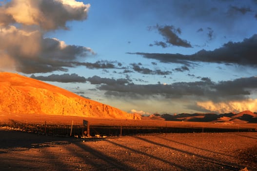 Landscape of mountains and skies at sunset on the highlands of Tibet
