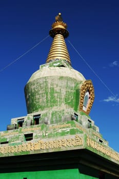 Landmark of a historic green stupa in Tibet