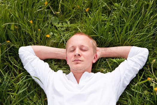 young man outdoor in summer in nature happy