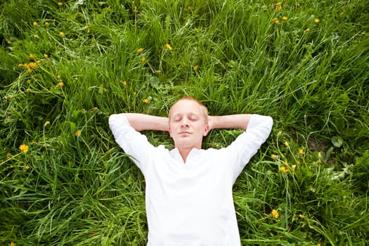 young man outdoor in summer in nature happy