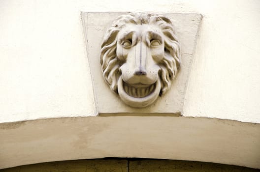 Lion symbol on ancient grunge architectural wall closeup.