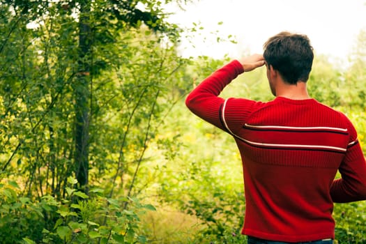 Man lost in nature and trying to find the way back home