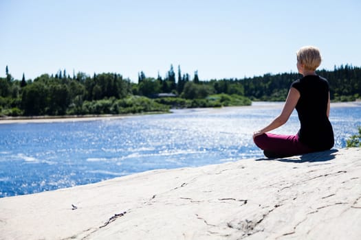 Yoga in nature with a young girl