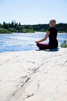 Yoga in nature with a young girl