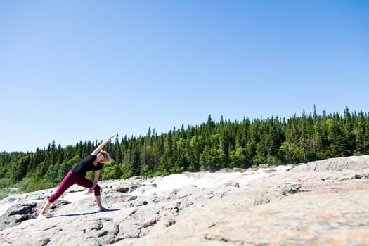 Yoga in nature with a young girl