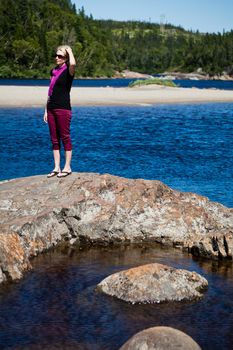 Girl standing on a rock