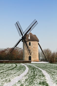 Traditional French windmill during the winter season.