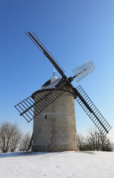 Traditional French windmill during the winter season.