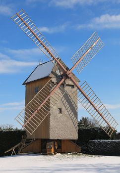 Image during the winter of a traditional wooden windmill in France in the Eure &Loir Valley region.This is Pelard's mill.