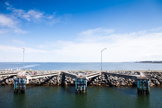 View of pier and the port on a sunny day of summer