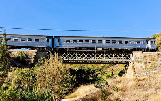 train on railway viaduct in Douro Valley, Portugal