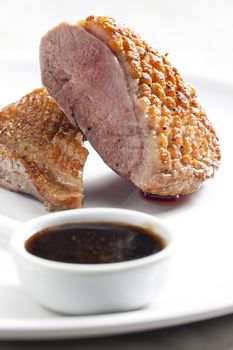 fried duck breast with sauce of honey, balsamico and red wine