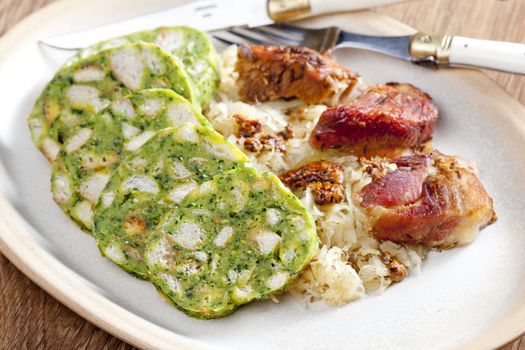 pork meat with herbal dumplings and cabbage