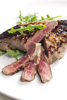 grilled beefsteak pickled in Dijon mustard with ruccola